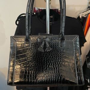 Snake skin print purse with bow.